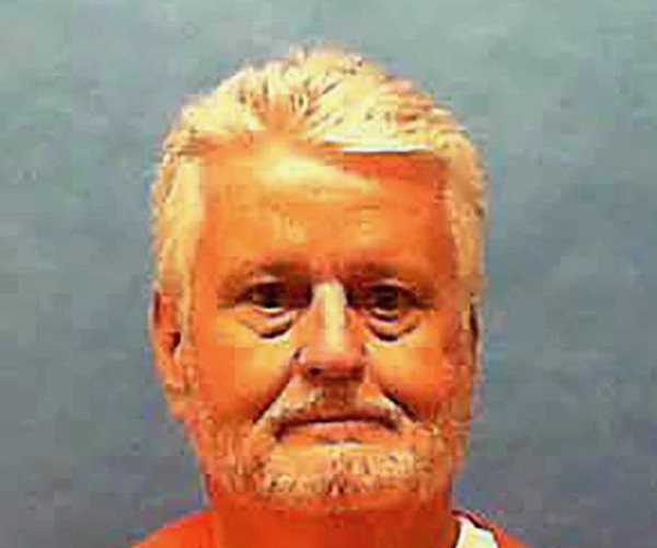 convicted serial killer bobby joe long pictured in orange prison jumpsuit facing camera
