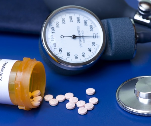 blood pressure pills coming out of prescription bottle