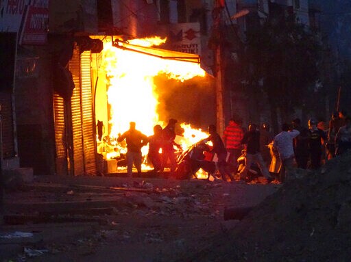 Hindu, Muslim Clashes Kill 13 in Delhi as Modi, Trump Talk