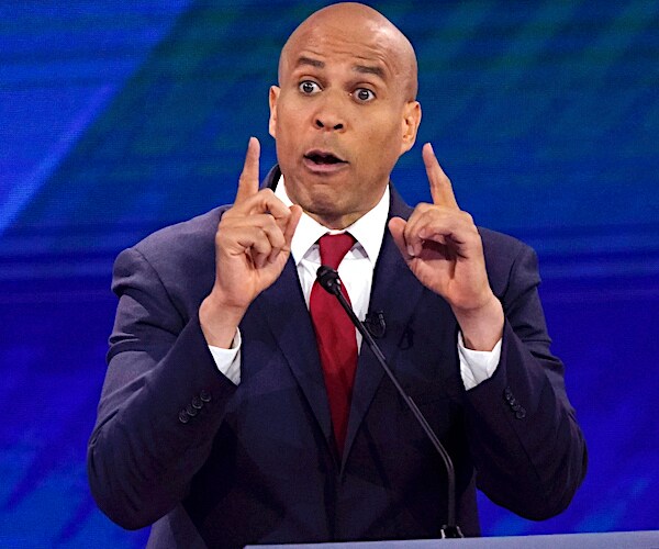 cory booker exults during a democratic presidential primary debate