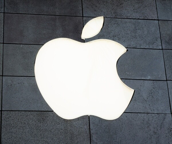 lit up apple logo with a gray background