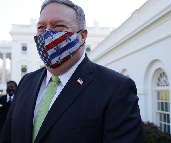 mike pompeo walks outside white house