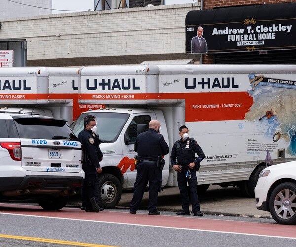two u-haul trucks are found to contains dozens of dead bodies