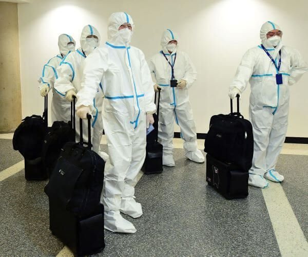 Air China flight crew in hazmat suits