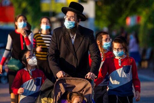 Israel, Palestinians Face New Restrictions amid Virus Surge