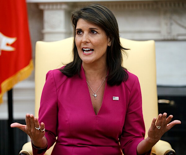 nikki haley throws both palms up in objection