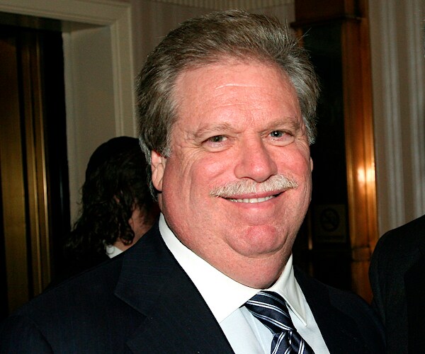 Republican fundraiser Elliott Broidy smiles after a fundraising event