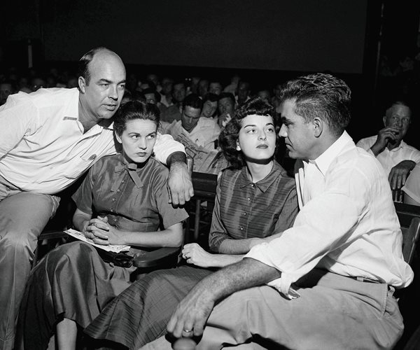 four people in a courtroom