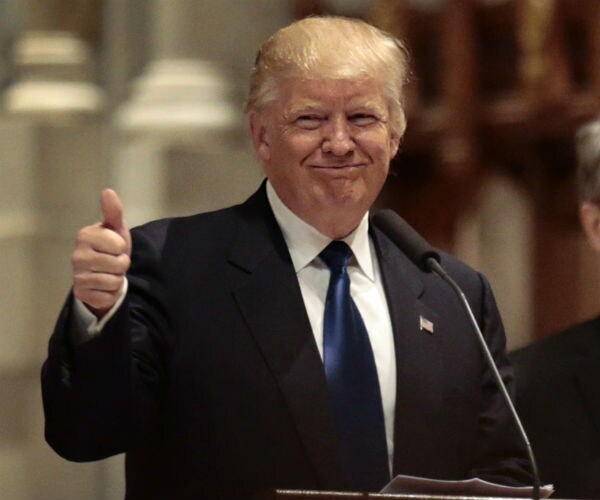 trump smiling and giving a thumbs up
