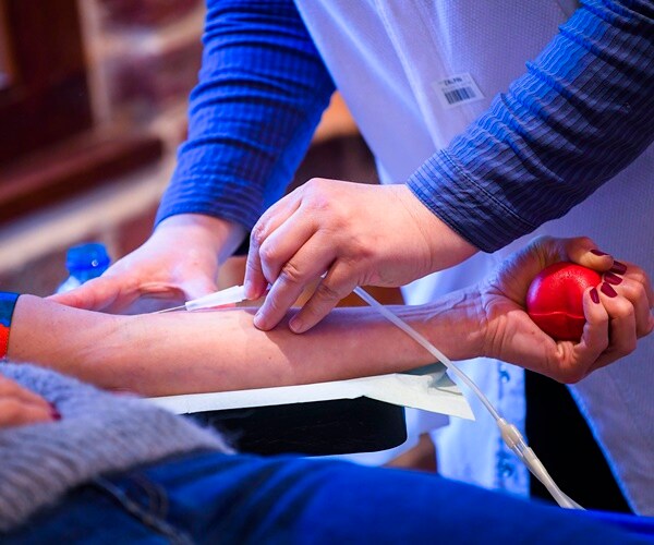 a woman donates blood