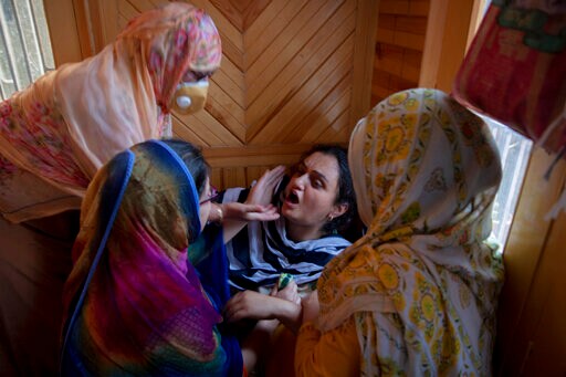 Photo of Toddler Sitting on Slain Grandpa Angers Kashmiris