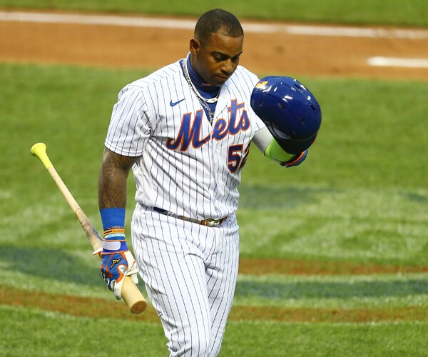 new york mets outfielder yoenis cespedes walks to the teams dugout