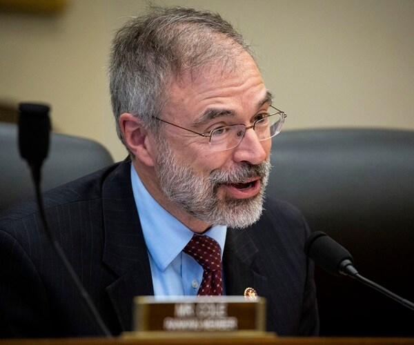 rep. andy harris asks a question sitting