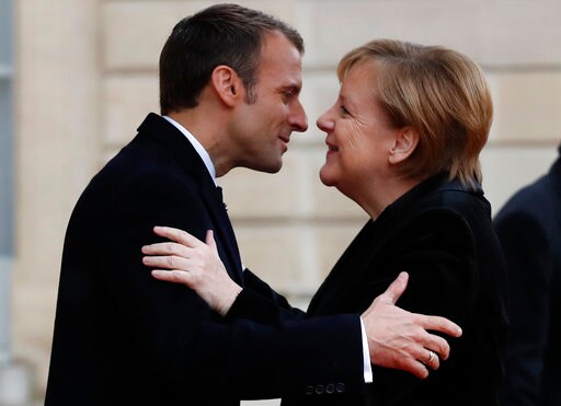 Macron, Merkel Seek Common Approaches to Trump, Euro