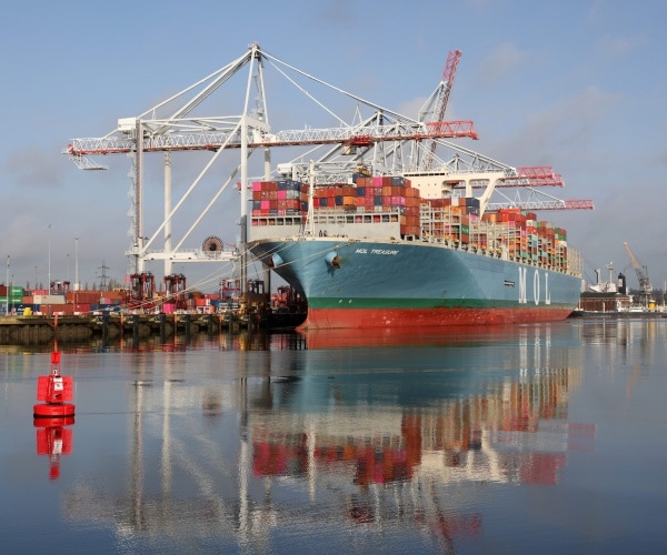 A cargo ship at the docks.