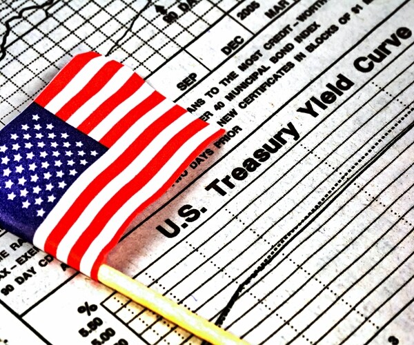 american flag and treasury yield curve chart 

