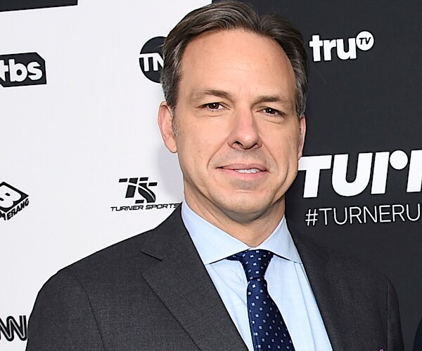 jake tapper gets photographed on the red carpet