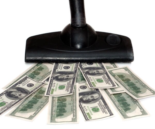 vacuum cleaner sucking up cash dollar bills 