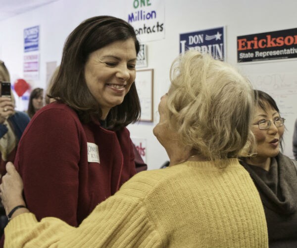 N.H.'s Ayotte Can't Shake Off Trump