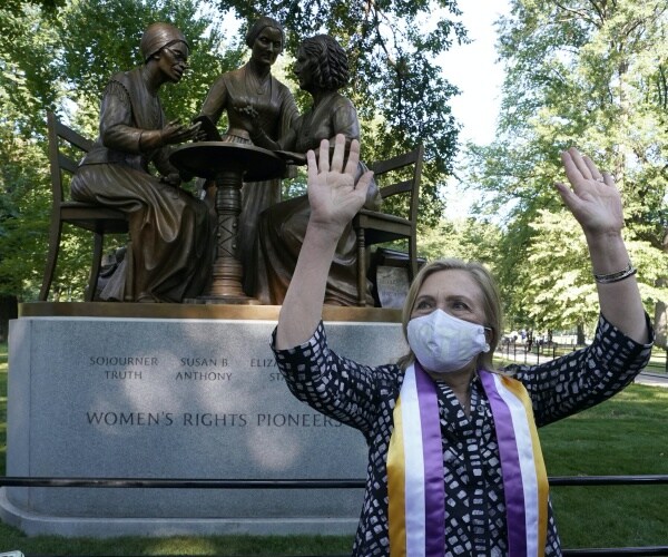 Hillary Clinton with arms up