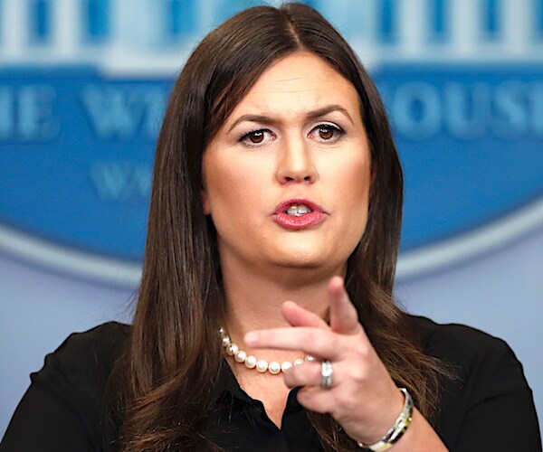 sarah sanders points into the media crowd to single out the next questioner