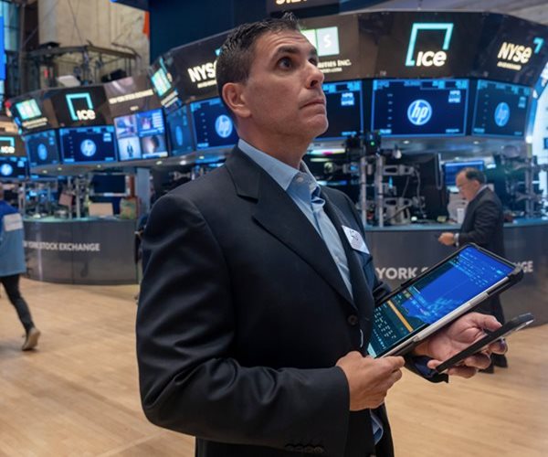 Dow Soars 559 Points, Notches Record High Close