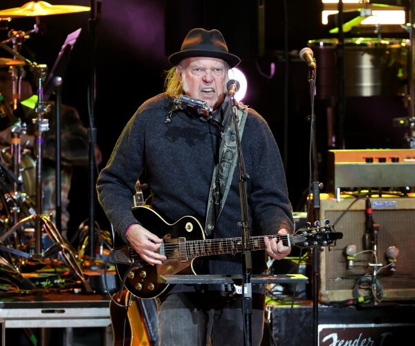 Neil Young has taken aim at Elon Musk with his newest protest song, a reworked version of Woody Guth...