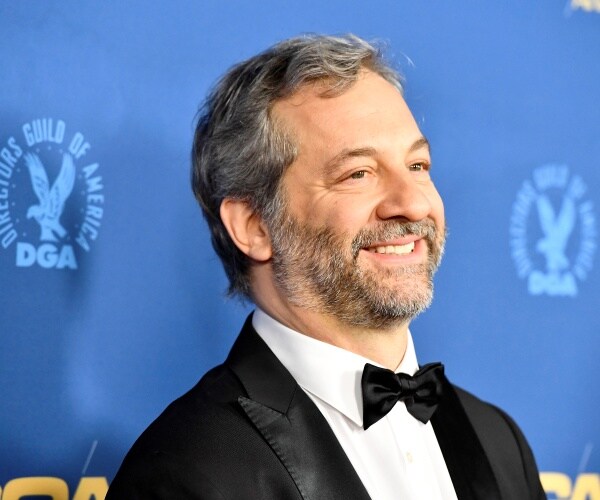judd apatow in a suit and bow tie smiling