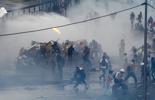 Venezuelan Protesters, Security Forces Clash at Air Base
