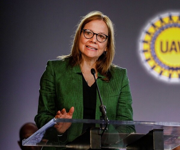 mary barra speaks into mic