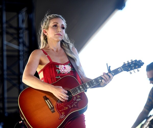 ashley monroe plays guitar onstage