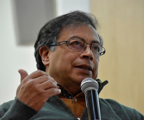 Gustavo Petro speaks into a microphone