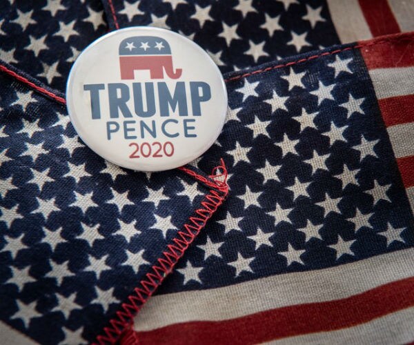 campaign button and us flags trump pence 2020 