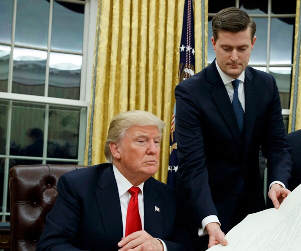 Former White House aide Rob Porter with President Donald Trump