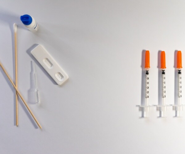 COVID tests and syringes for vaccines