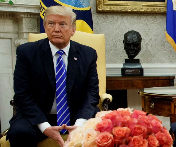 president trump in an oval office meeting with key congressional members