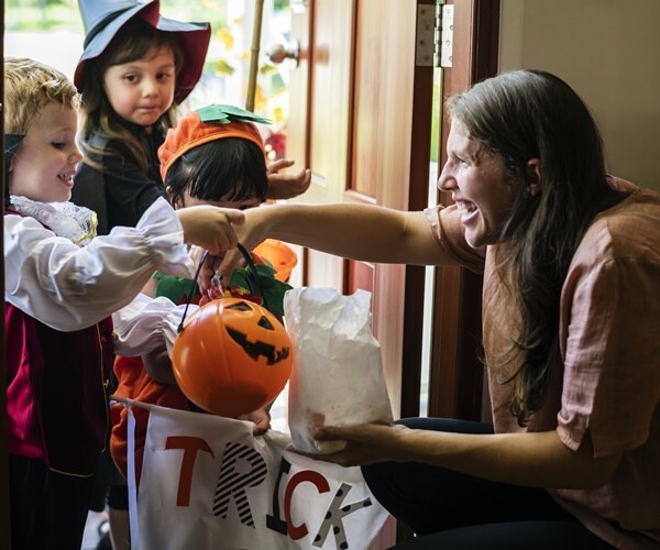 children get candy while trick or treating
