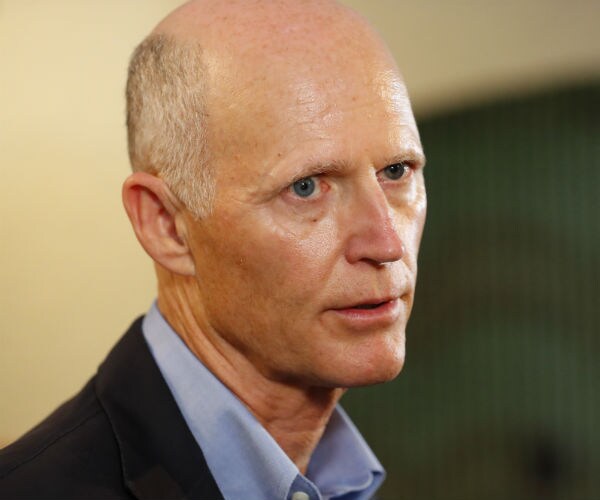 Senator Rick Scott, R-Fla., speaks to members of the media
