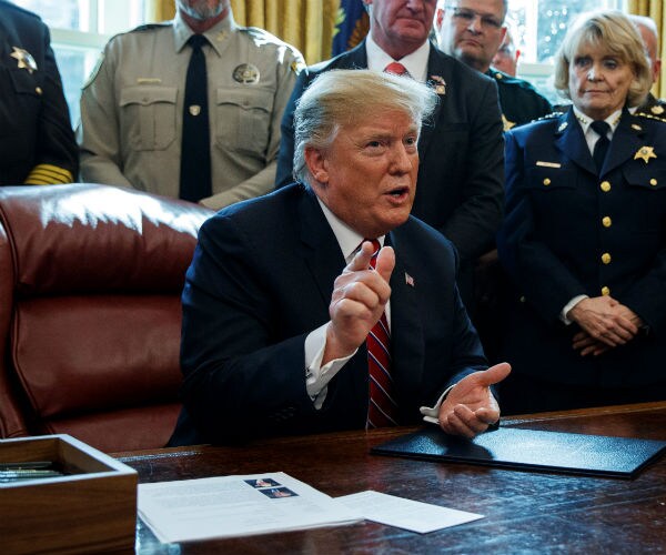 president donald trump in the oval office of white house speaking on border security 
