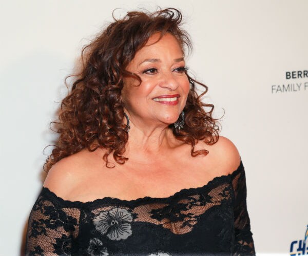 debbie allen is shown in a black lace dress