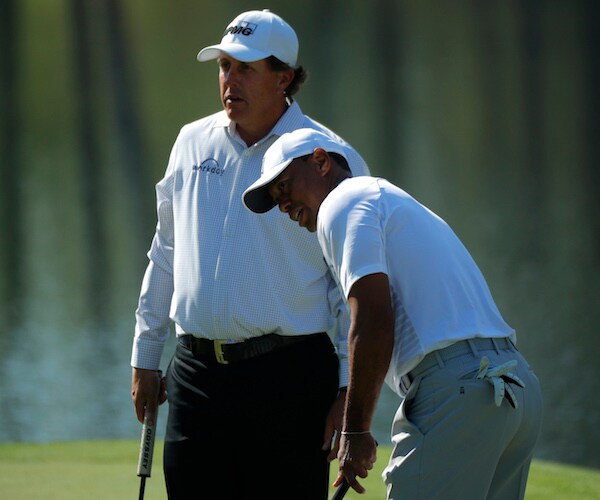 golfers tiger woods and phil mickelson on the green