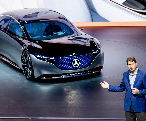 Mercedes CEO Ola Kaellenius stands in front of a concept car