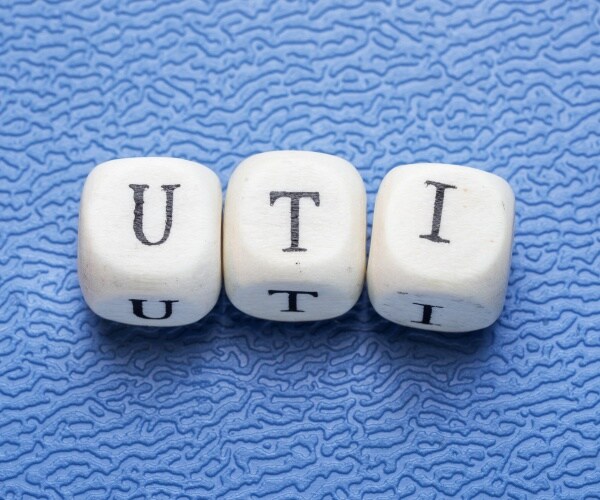 U-T-I spelled out in blocks