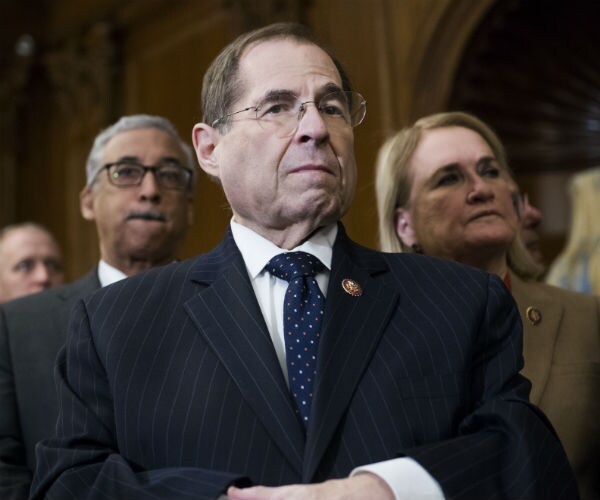 jerry nadler stands and listens during a news conference