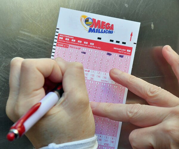 a mega millions lottery ticket is worked in new york city