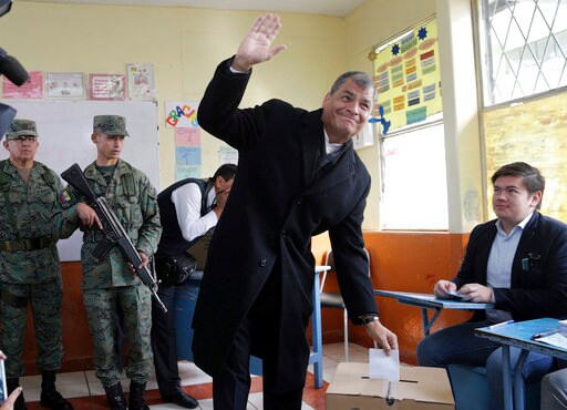 The Latest: Ecuadoreans Choosing President in Close Race