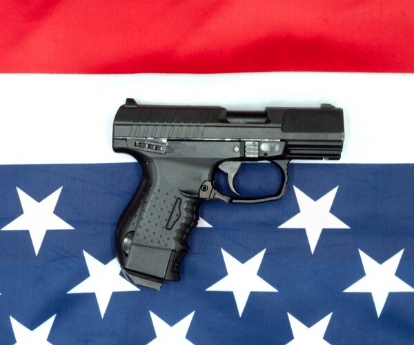 gun on an American flag