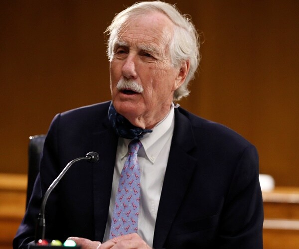 angus king speaks into microphone