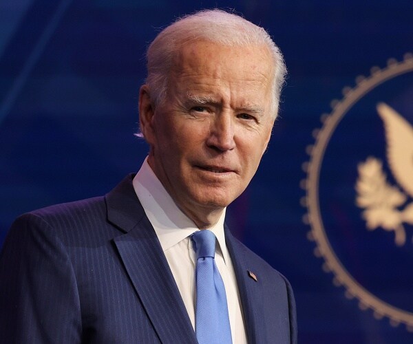 joe biden stands onstage