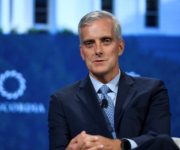 mcdonough in a suit and blue polka dotted tie